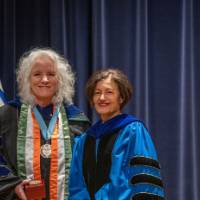 Provost Mili and woman take picture